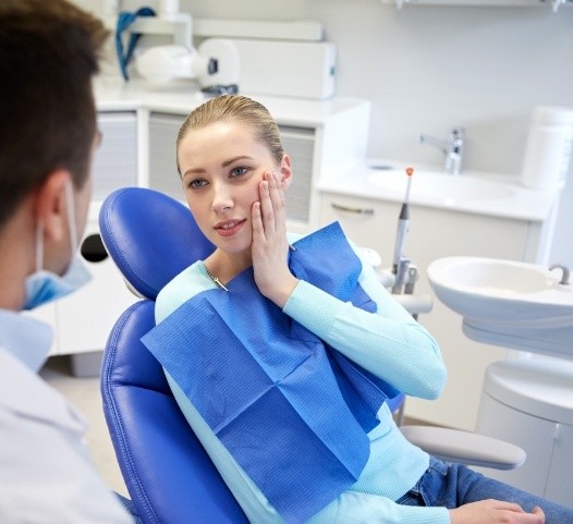Woman in dental chair for emergency dental visit