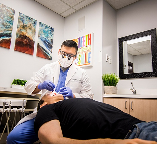 Doctor Le treating dental patient